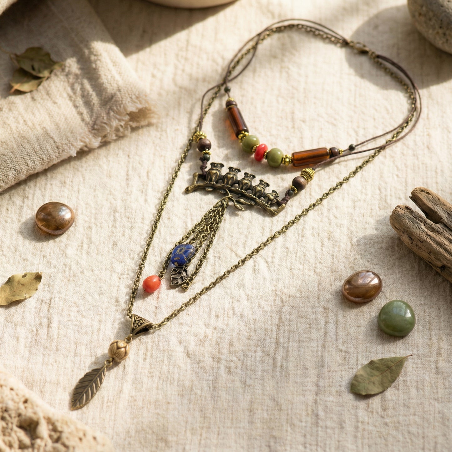 Necklace with beads and stones on a textured fabric background