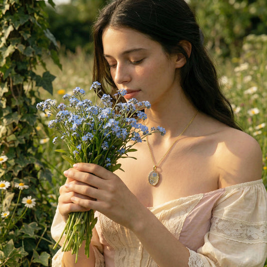 Woman holding a bouquet of blue flowers in a natural setting