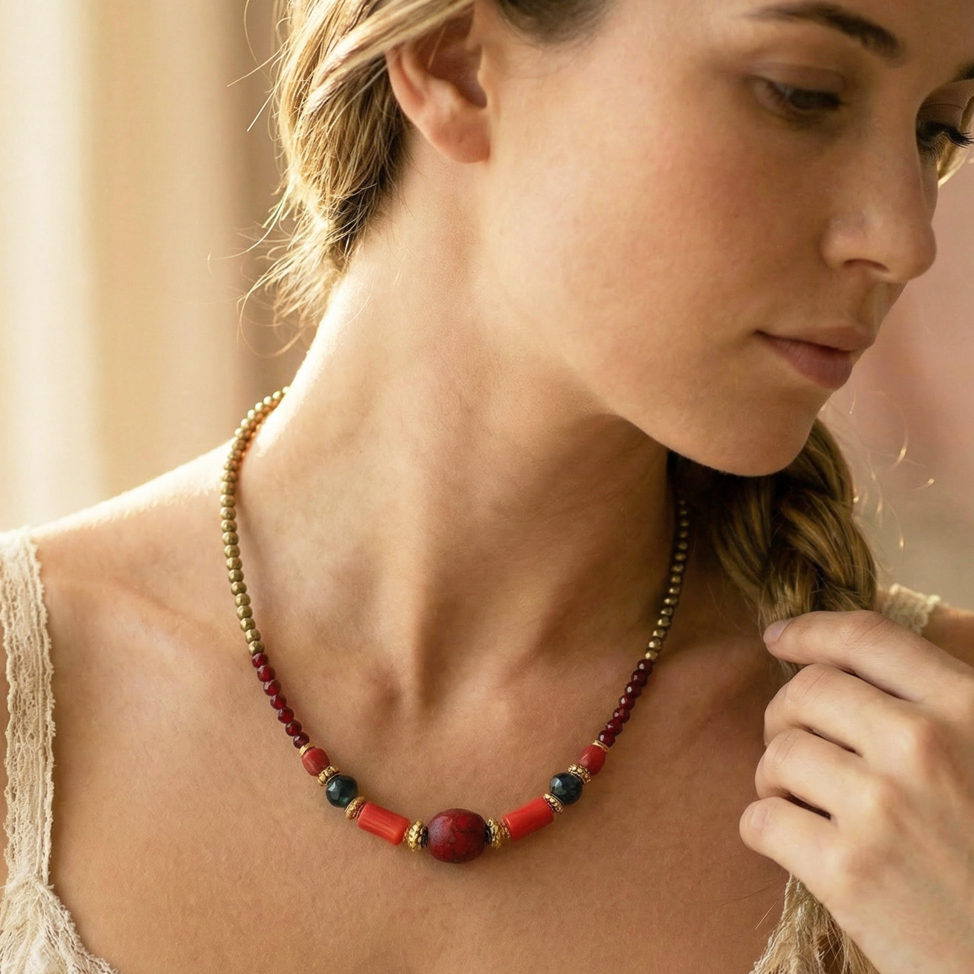 Woman wearing a colorful beaded necklace with a soft background