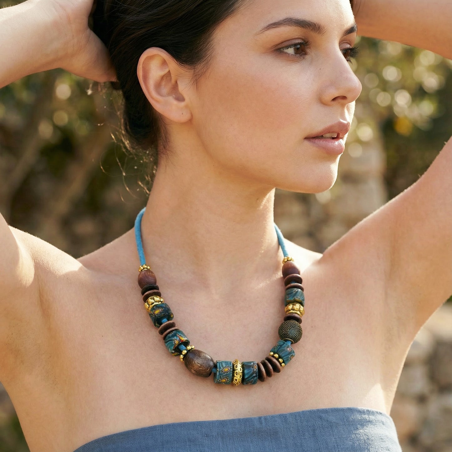 Woman wearing a colorful beaded necklace outdoors