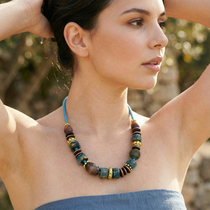 Woman wearing a colorful beaded necklace outdoors