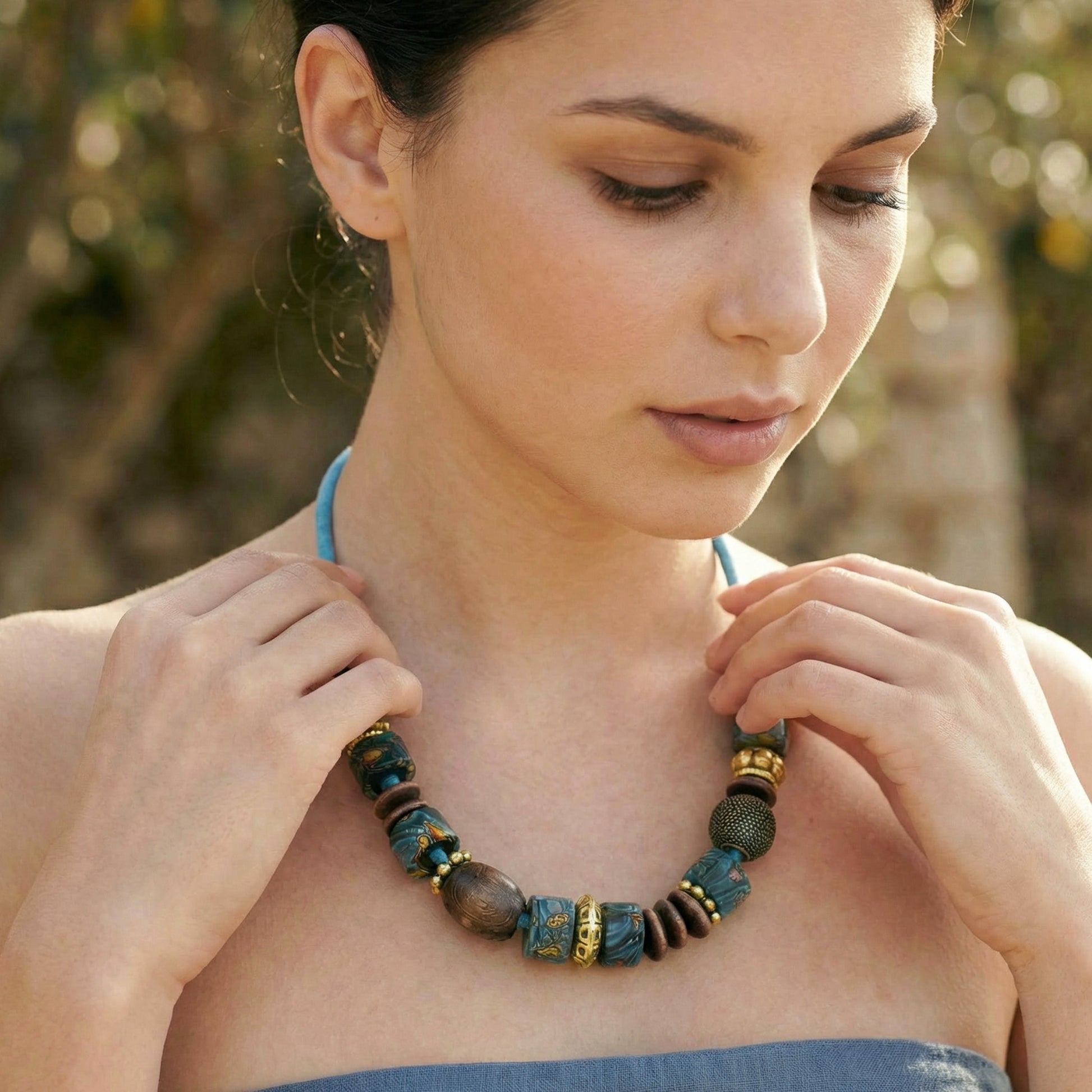 Woman wearing a beaded necklace outdoors