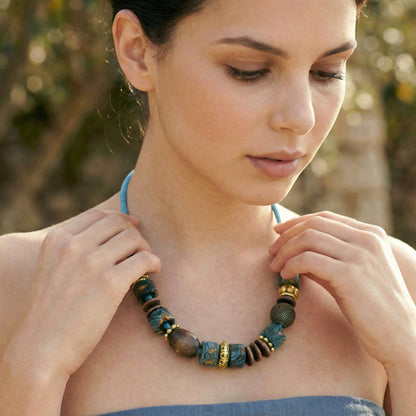 Woman wearing a beaded necklace outdoors