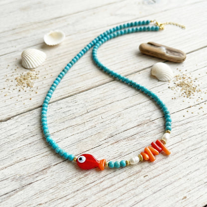 Necklace with colorful beads on a wooden surface
