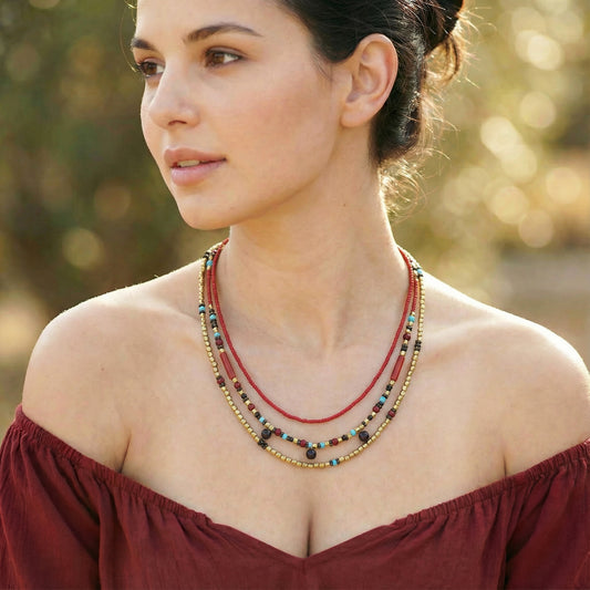 Woman wearing a colorful beaded necklace outdoors