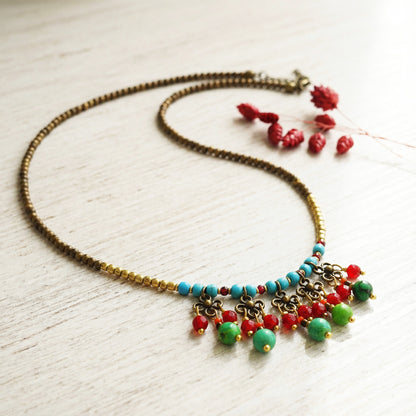 Necklace with colorful beads on a light wooden surface