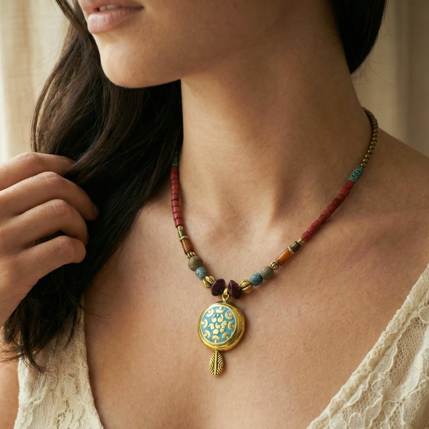 Necklace with a colorful pendant worn by a person
