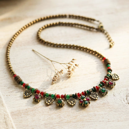 Decorative necklace with beads on a light wooden surface