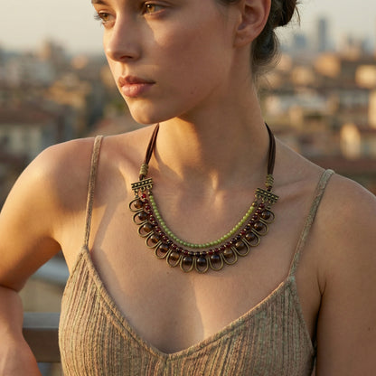 Woman wearing a decorative necklace with a blurred cityscape in the background