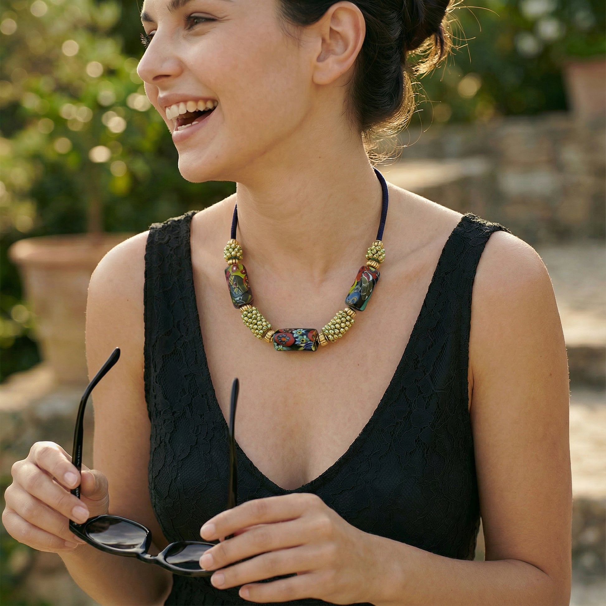 Woman wearing a colorful necklace outdoors