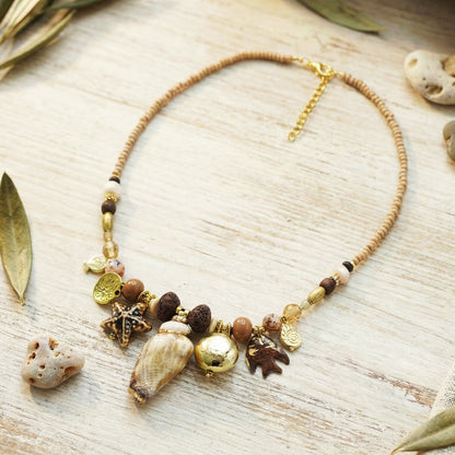 Necklace with natural elements on a wooden surface