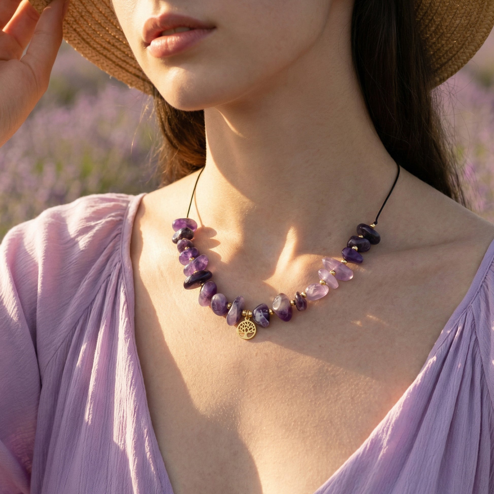 Woman wearing a purple necklace with lavender field in the background