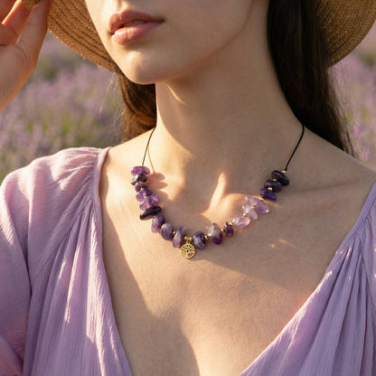 Woman wearing a purple necklace with lavender field in the background