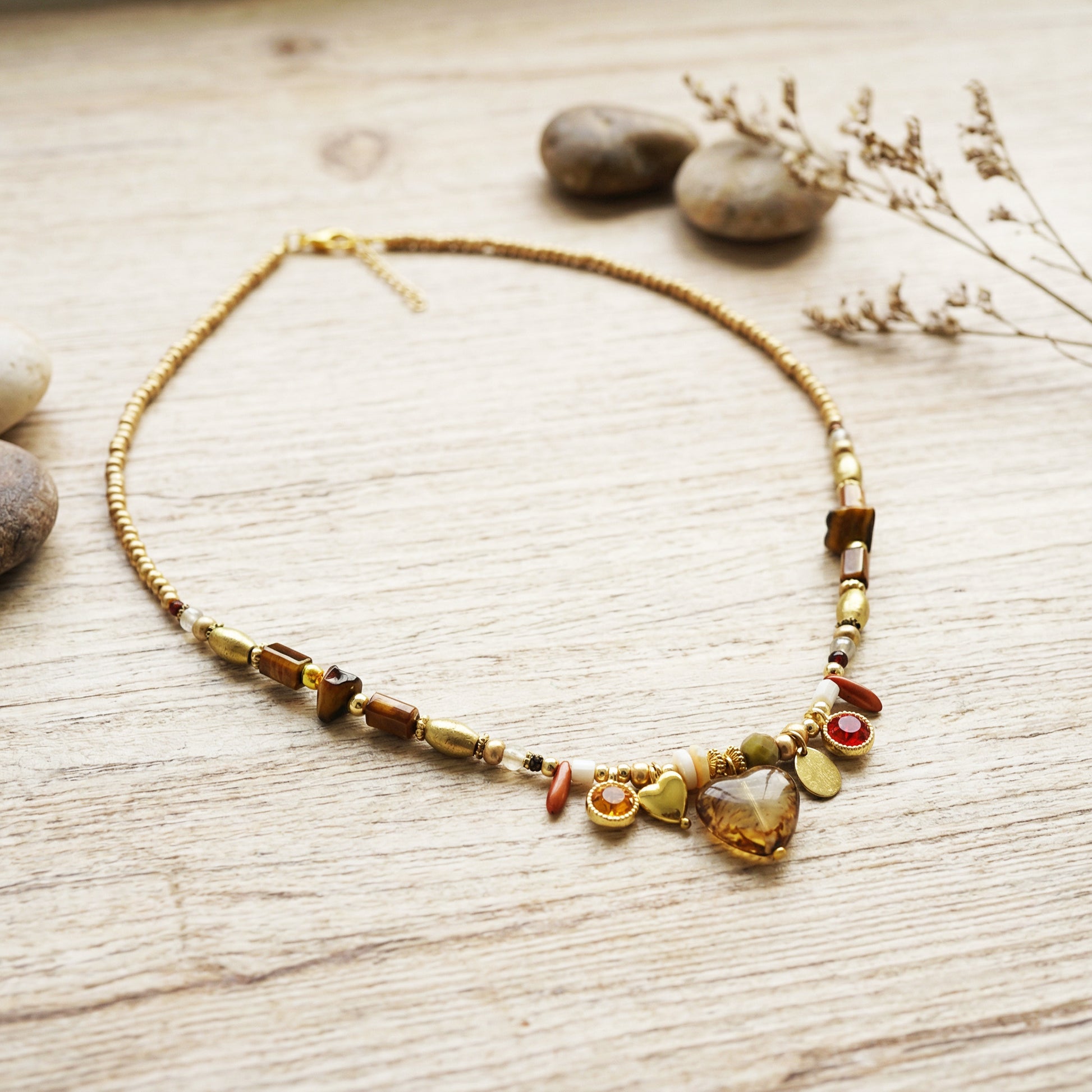 Necklace with heart-shaped pendant on a wooden surface