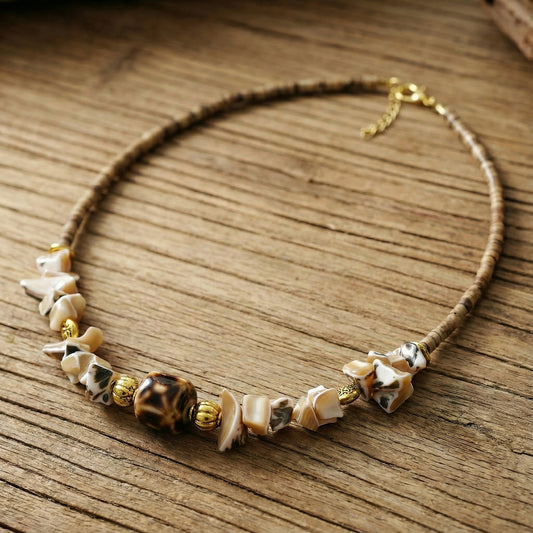 Necklace with natural beads on a wooden surface