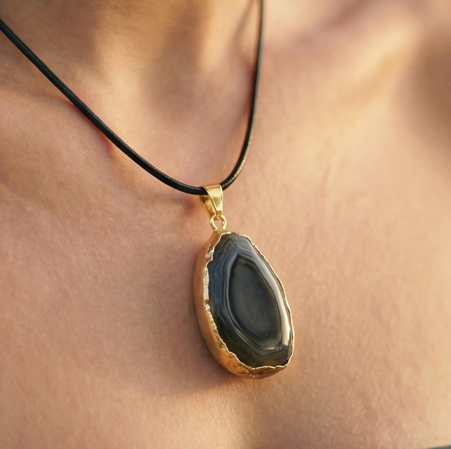 Necklace with a pendant on a person's neck