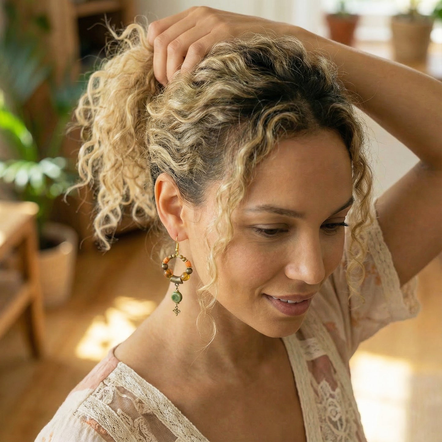 Woman with styled hair in a room with plants
